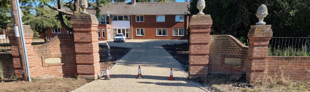This is a photo of a newly installed chip and tar driveway, installed by NS Driveways Dorking