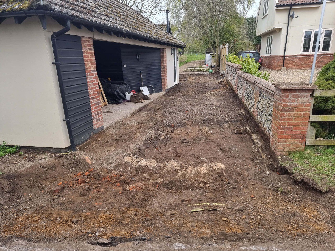 This is a tarmac driveway that is in the process of being dug out and installed by NS Driveways Dorking